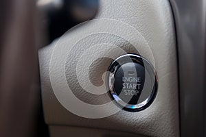 Button start and turn off the ignition of the car engine close-up on the dashboard, electric key, of modern design with elements