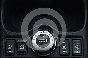 Button switches control for car with soft-focus and over light in the background. 2WD AUTO LOCK BUTTON SWITCH