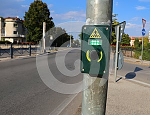Button to activate the green light in the crosswalk