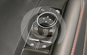 Button to control the side mirrors in the passenger car