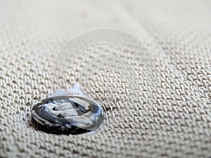 Button on a vintage dull brown shirt close up