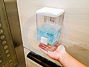 After the button was pressed, a hand sanitizer dispenser was installed in public areas during the COVID-19 outbreak. This one was