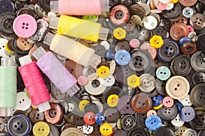 Buttons and bobbins of thread