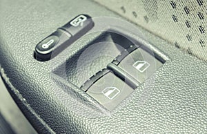 Buttons controlling windows in car. Car window switch