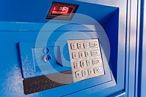 Buttons for entering a pincode on a blue machine for issuing online orders