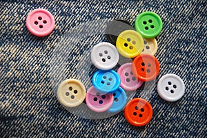 Buttons on jeans background