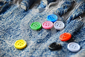 Buttons on jeans background