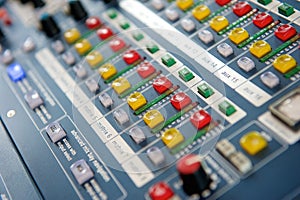 Buttons and knobs on audio mixer