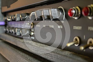 Buttons, knobs and lights of a guitar amplifier