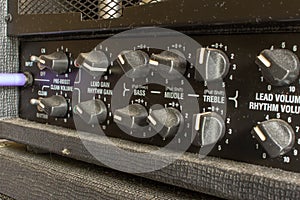 Buttons, knobs and lights of a guitar amplifier