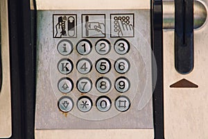 Buttons of an old steel payphone