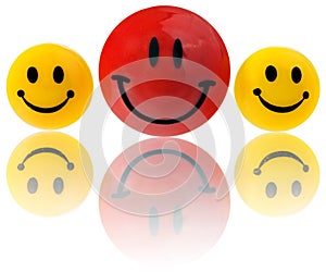 Buttons, round smiling emoticons in yellow, red. Mounted on a magnet to the refrigerator.