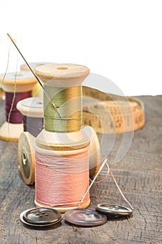 Buttons and sewing thread with needle