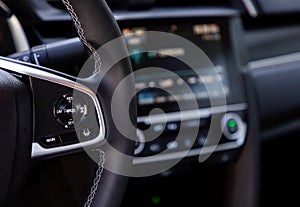 Buttons on steering wheel in a car