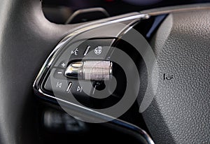 Buttons on steering wheel in a car