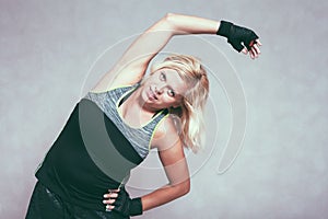 Buxom sporty woman stretching body photo