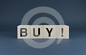Buy. Cubes form the word Buy