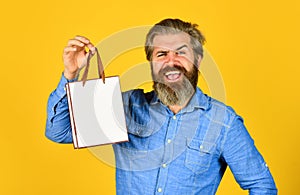 Buy gift. Bearded man hold shopping bags. Retail concept. Happy holidays. Handsome buyer. Seasonal sale. Boost sales