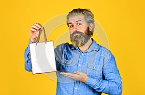 Buy gift. Black Friday. Cyber monday sale. Nice purchase. Bearded man hold shopping bags. Retail concept. Happy holidays