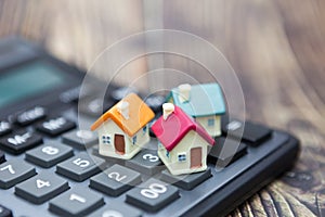 Buy home. Houses is placed on the calculator