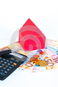 Buy a house, investment concept, calculator, euro banknotes and coins