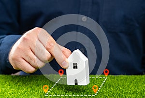 Buy land for a house. Build a house on the plot. Zoning and Land Use. photo