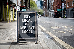 BUY LOCAL OR BYE - BYE LOCAL. Foldable advertising poster photo