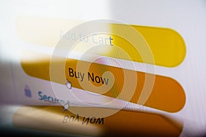 Buy now button on screen. Buying items online on amazon or ebay