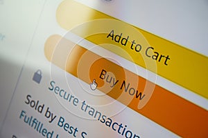 Buy now button on screen. Buying items online on amazon or ebay