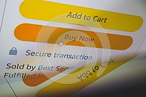 Buy now button on screen. Buying items online on amazon or ebay