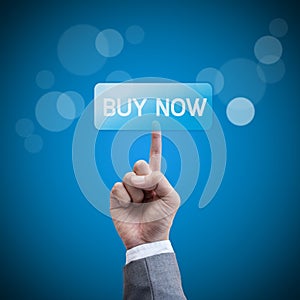 Buy now. hand man pressing buy button.