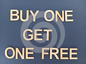 Buy one get one free sign on a blue background