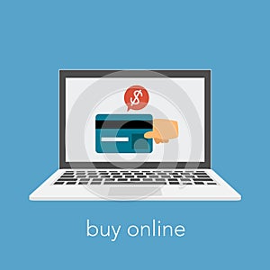 Buy online slogan with laptop and credit card. A hand making payment