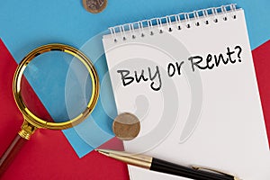 Buy or Rent the text is written in a white notepad, red background