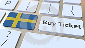 Buy ticket text and flag of Sweden on the buttons on the computer keyboard. Travel related conceptual 3D animation