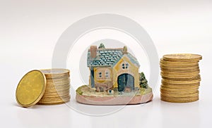 Buy your Dream House concept with Golden Coins stack