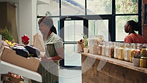 Buyer choosing fresh fruits and vegetables from crates