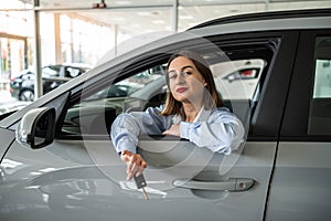 buyer client inside modern car at showroom, concept of sale or rent vechile