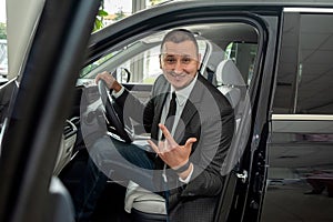 buyer client inside modern car at showroom, concept of sale or rent vechile