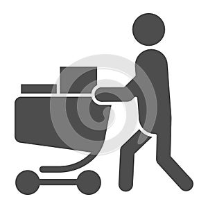 Buyer with full cart solid icon. Person with a full grocery cart vector illustration isolated on white. Shopping glyph