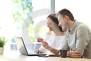 Buyers buying online with credit card photo