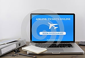 Buying airline tickets online on laptop