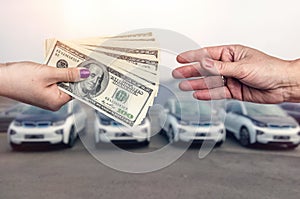 `Buying car ` conception, dollar deal between female hands