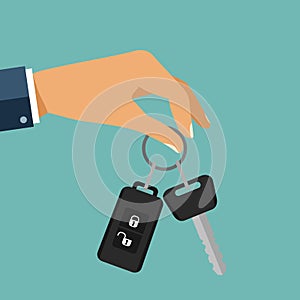 Buying the car. The hand holding the car key with remote control