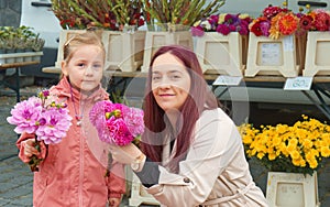 Buying fresh flowers at farmers market in Prague