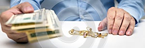 Buying gold jewelry, us dollars and hand of a businessman, panorama