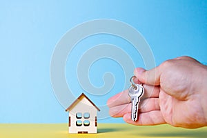 Buying a house. The buyer receives the key to the property.
