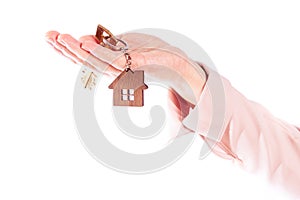 buying a house, hand with keys to the house, isolate on a white background