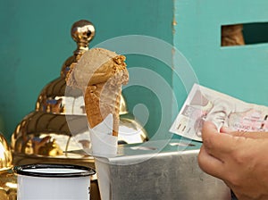 Buying ice cream at street food market in downtown Prague