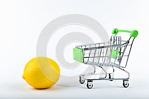 Buying lemons. trading concept. Online shopping concept. Cart and lemons over a white background. business concept. Healthy eating